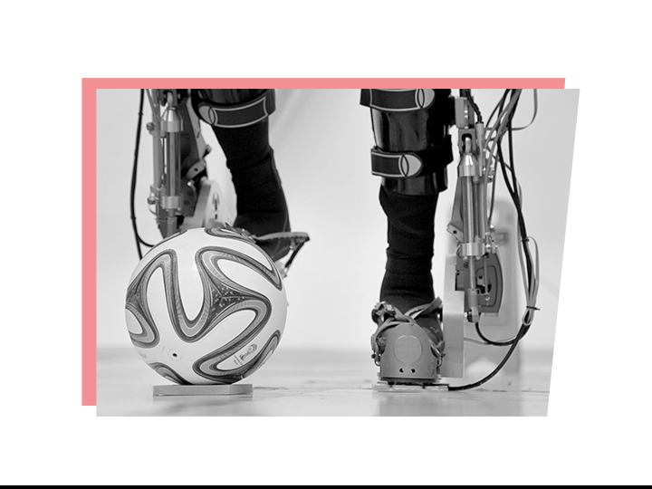 Legs within a powered exoskeleton kicking a ball